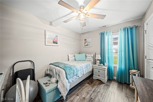 bedroom featuring ceiling fan and dark hardwood / wood-style flooring