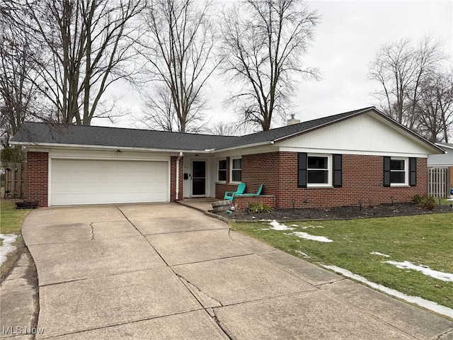 single story home featuring a garage and a front yard