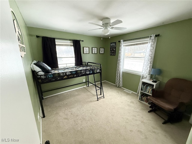 carpeted bedroom with ceiling fan