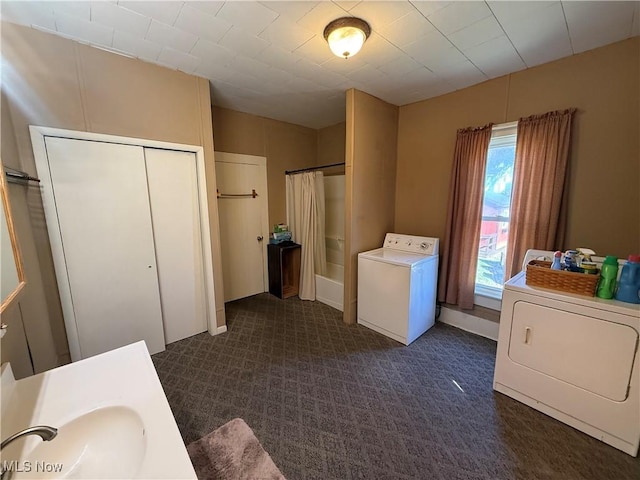 laundry room with independent washer and dryer and sink