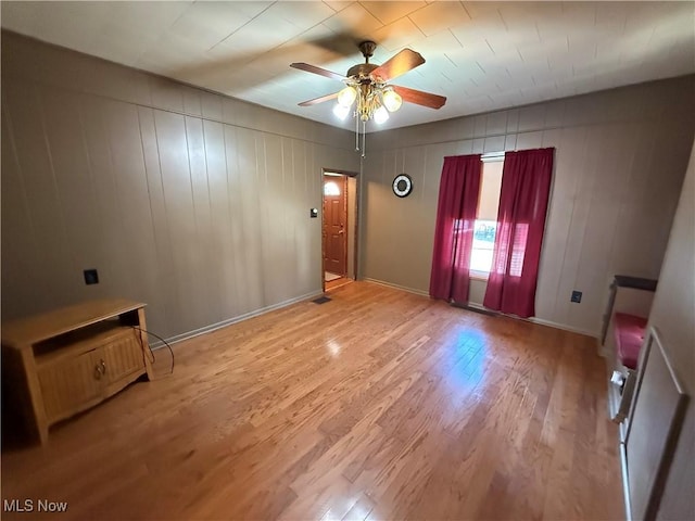 unfurnished room featuring wood-type flooring and ceiling fan