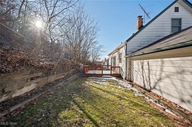 view of yard with a deck