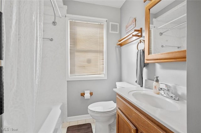 full bathroom featuring vanity, tile patterned floors, shower / bath combo with shower curtain, and toilet