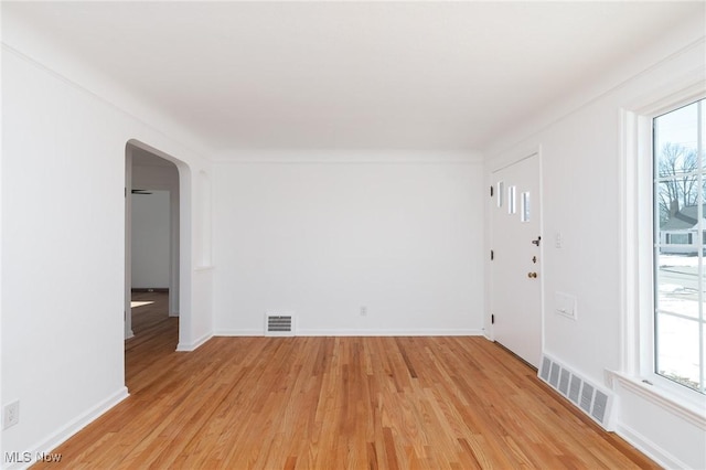 spare room featuring light hardwood / wood-style flooring