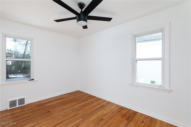 unfurnished room featuring hardwood / wood-style floors and ceiling fan