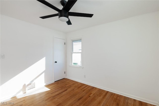 unfurnished room with hardwood / wood-style flooring and ceiling fan