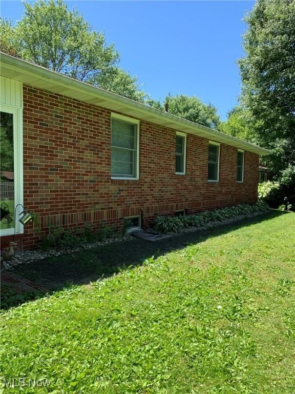 view of property exterior featuring a yard