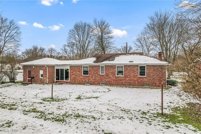 view of snow covered property