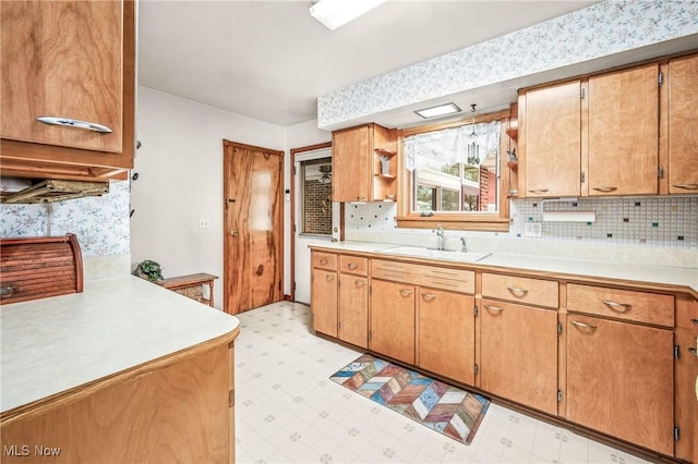 kitchen with sink and backsplash