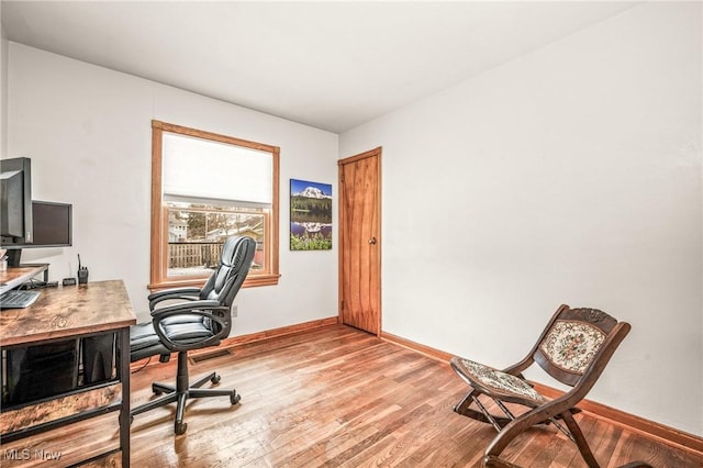 office area with light hardwood / wood-style floors