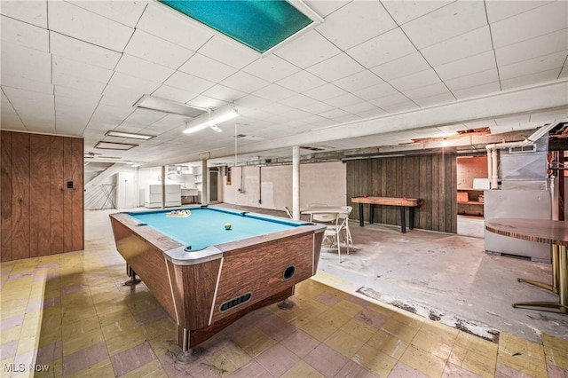 playroom with billiards and wooden walls