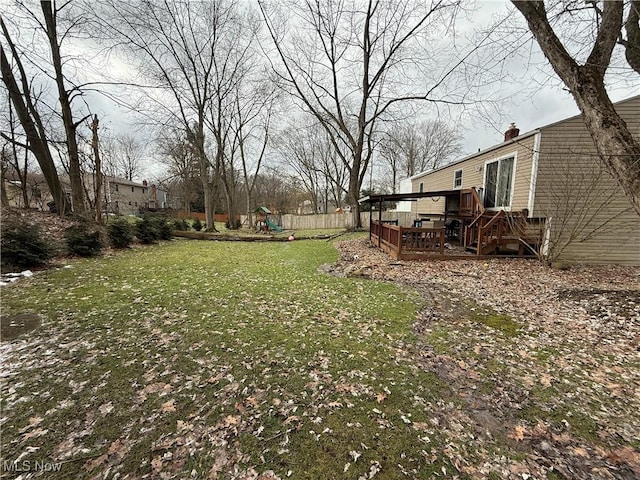 view of yard with a playground and a deck