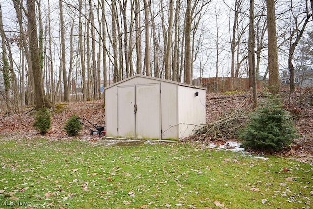 view of outbuilding with a lawn