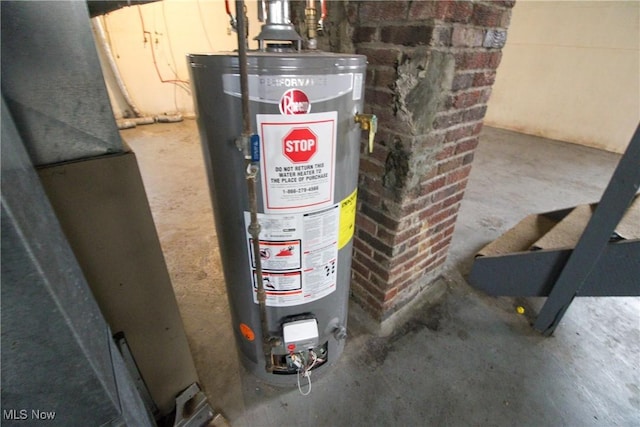 utility room featuring water heater