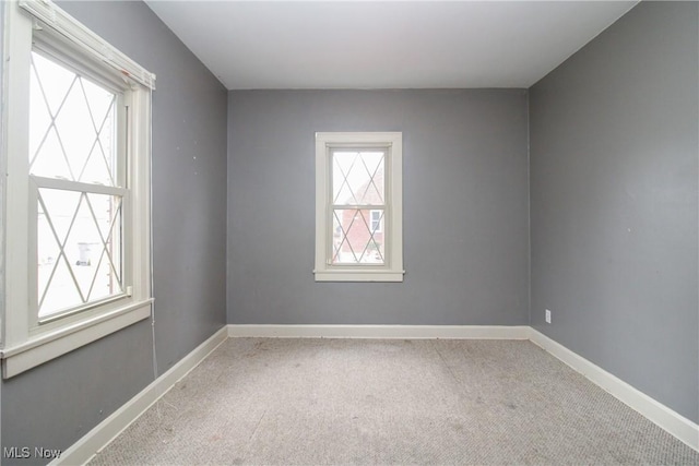 spare room featuring carpet