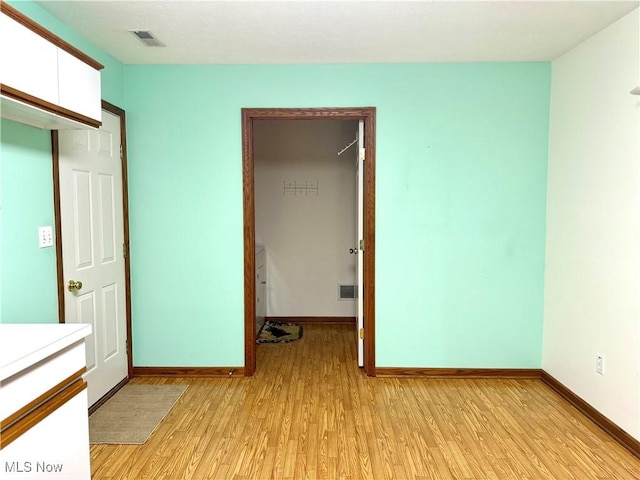 unfurnished bedroom with light hardwood / wood-style flooring