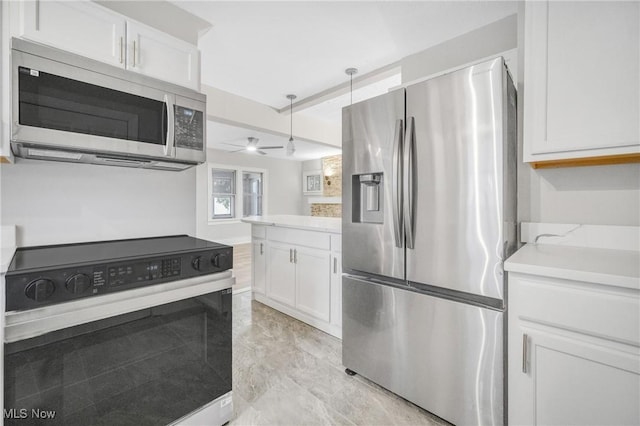 kitchen with ceiling fan, stainless steel appliances, light countertops, and white cabinetry