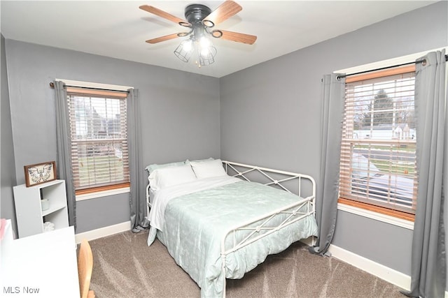 carpeted bedroom featuring ceiling fan