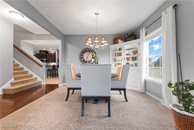 dining area with a notable chandelier