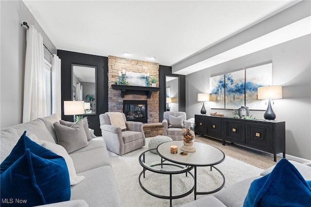 carpeted living room with a fireplace