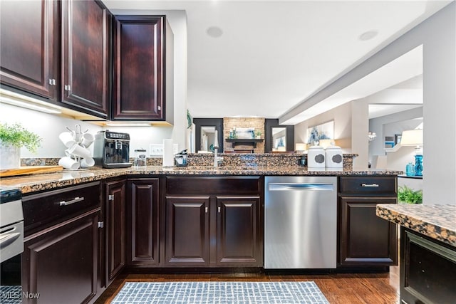 kitchen with dark stone countertops, dark brown cabinets, dark hardwood / wood-style floors, and dishwasher