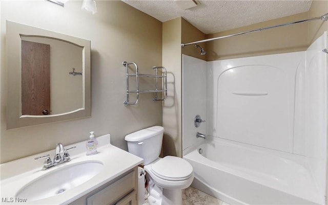 full bathroom featuring vanity, toilet, bathing tub / shower combination, and a textured ceiling