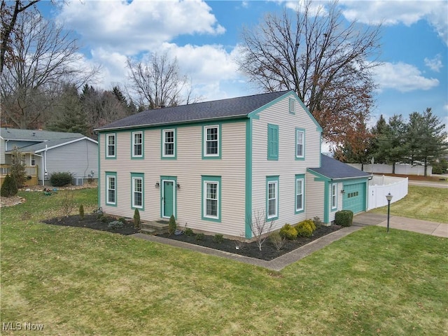 view of front of house featuring a garage and a front yard