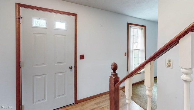 entryway with light hardwood / wood-style flooring