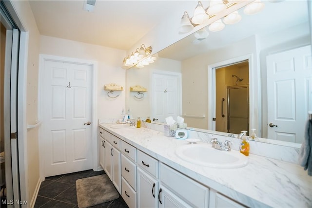 bathroom with vanity, tile patterned floors, and walk in shower