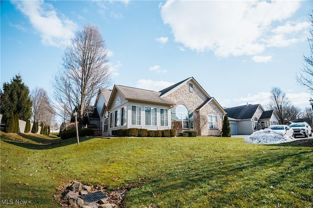 ranch-style home with a front lawn