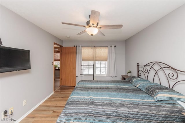 bedroom featuring ceiling fan and light hardwood / wood-style floors