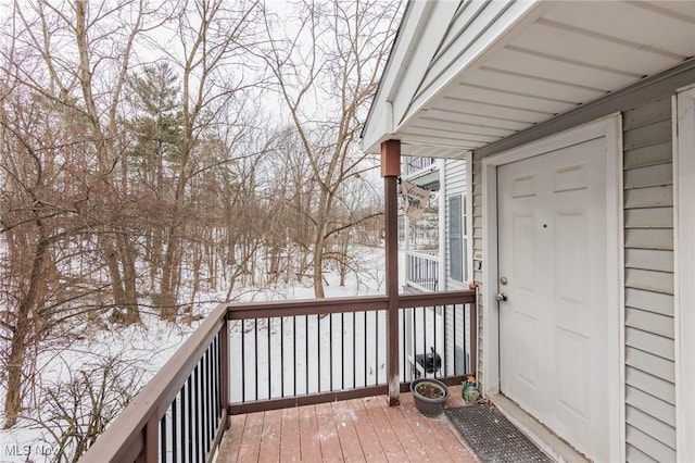 view of snow covered deck