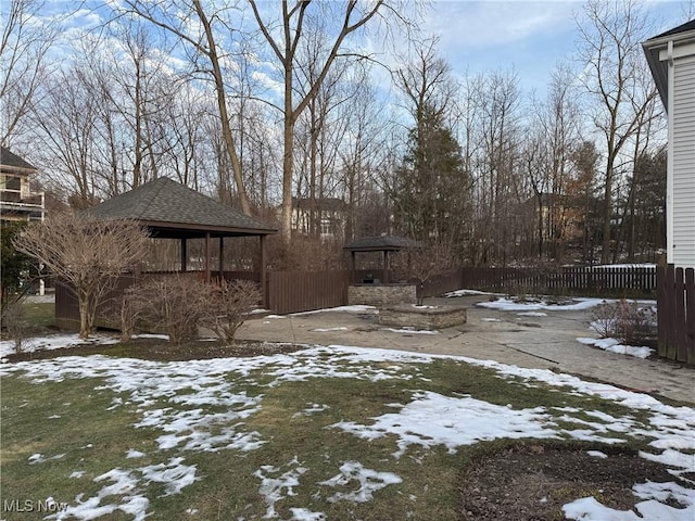 view of yard layered in snow