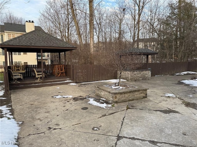 snow covered patio with a gazebo