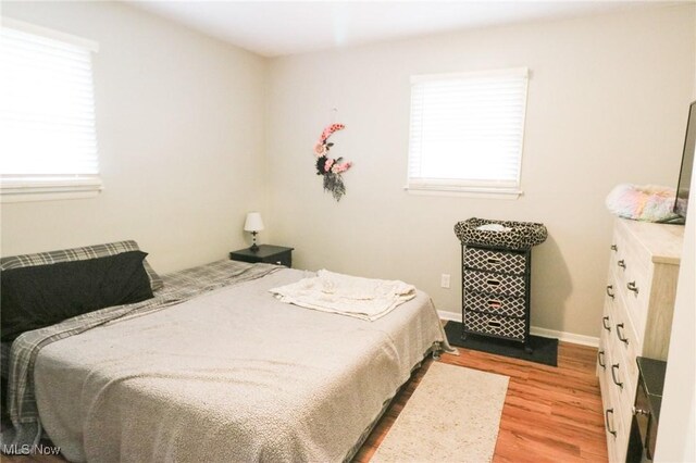 bedroom featuring light wood-type flooring