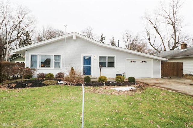 single story home with a garage and a front lawn