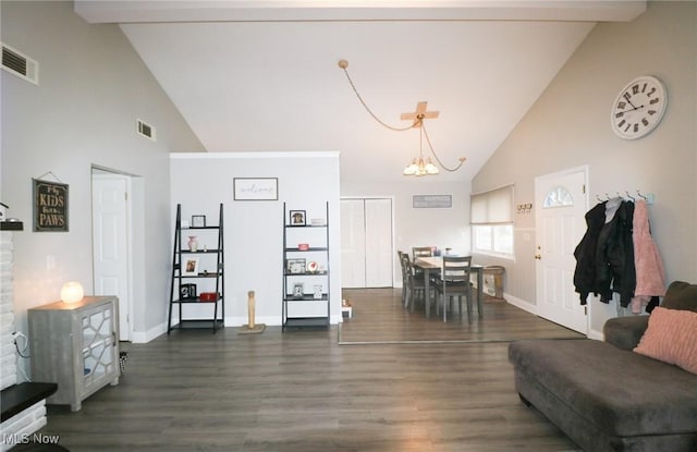 living room featuring dark hardwood / wood-style flooring, a chandelier, high vaulted ceiling, and beam ceiling