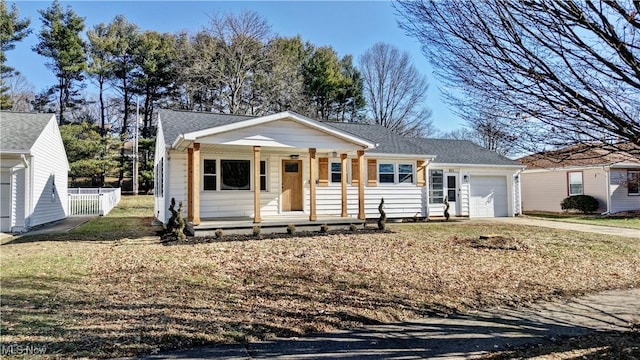 view of front of house featuring a garage and covered porch