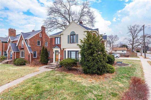 view of front of home with a front lawn