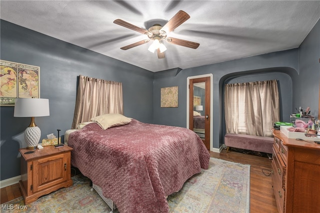 bedroom featuring ceiling fan and light hardwood / wood-style floors