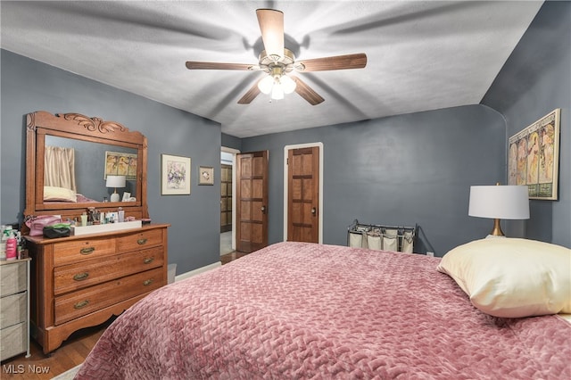 bedroom with hardwood / wood-style flooring and ceiling fan