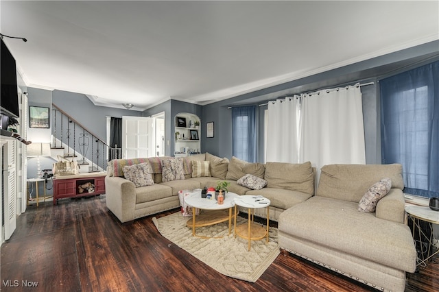 living room featuring crown molding and dark wood-type flooring