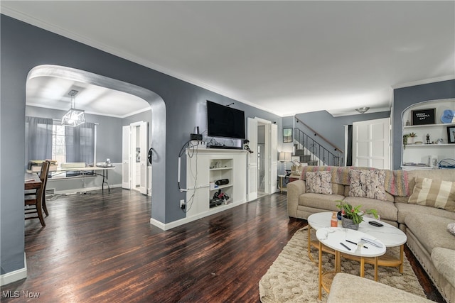 living room with ornamental molding and dark hardwood / wood-style floors