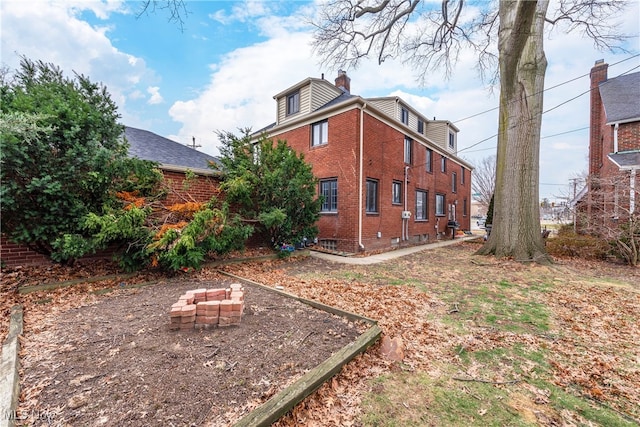 view of yard with an outdoor fire pit