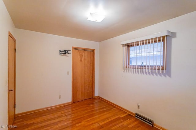 empty room with light wood-type flooring