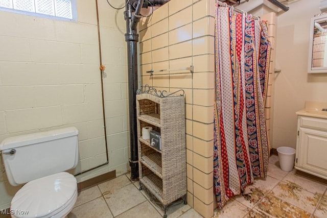 bathroom featuring vanity, toilet, and curtained shower