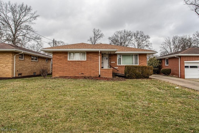 view of front facade with a garage and a front lawn