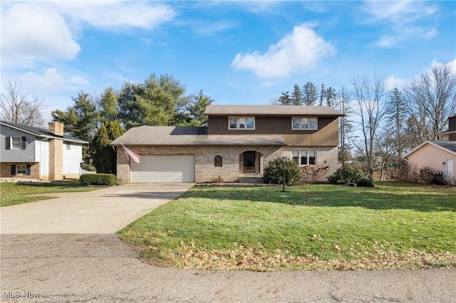 view of front of home featuring a garage and a front yard