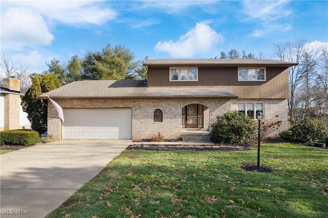 view of property featuring a garage and a front yard