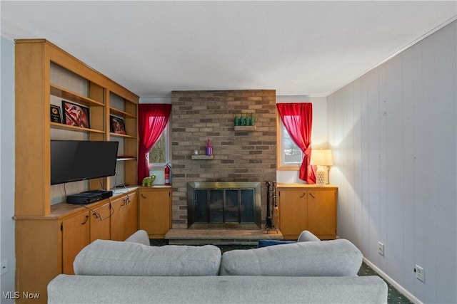 living area featuring a brick fireplace and a wealth of natural light